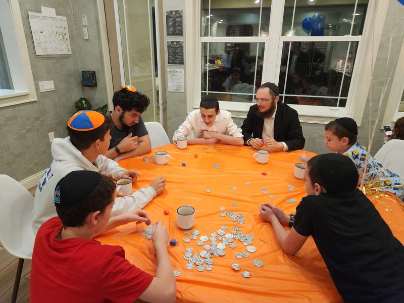 Teens sharing a Jewish moment with the rabbi