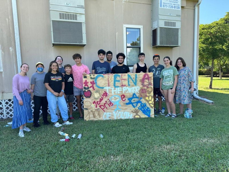 Teens socializing around the table at a CTeen event